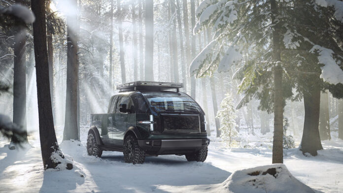 Canoo electric pick-up in a snowy forest