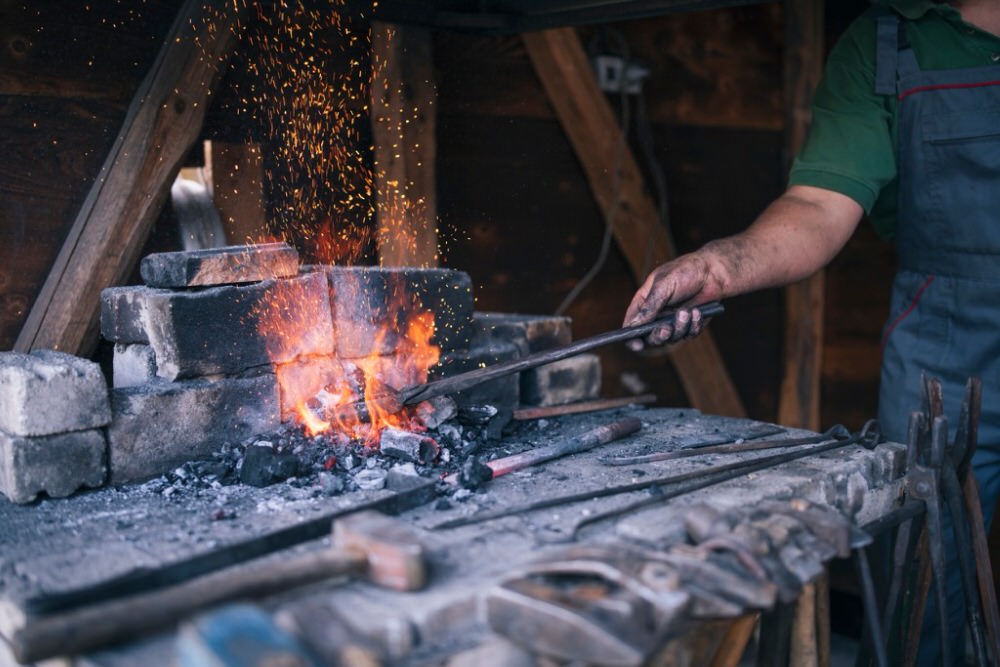 Blacksmith working at a forge