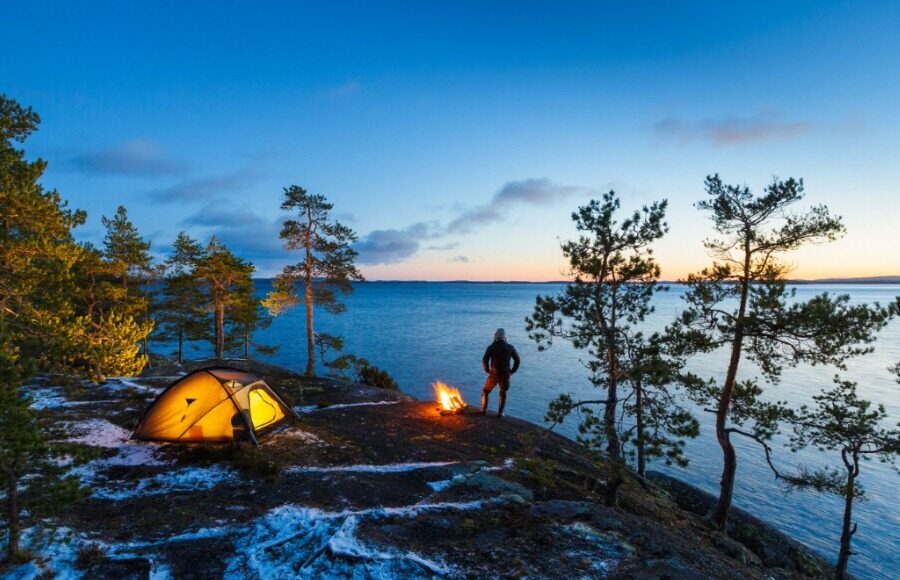 Person Camping next to a lake