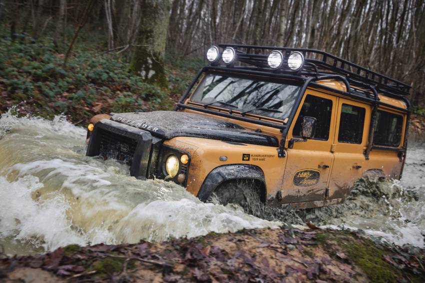 camel trophy design land rover driving in high water in a river