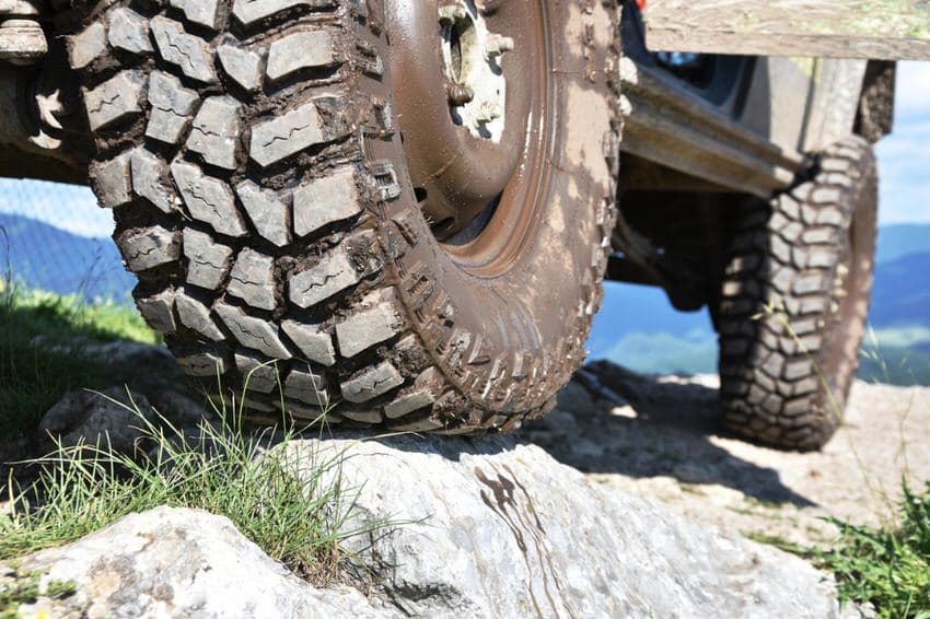 Close up of 4x4 tires on rocks