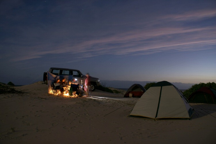 Overland Camping at night with a 4x4 and tent