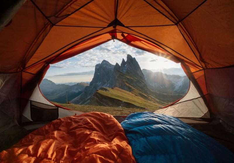 view of a mountain from inside a tent