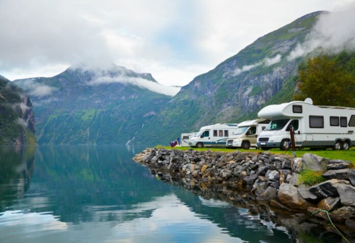 RVs parked by a river on a Luxurious Overlanding Trip