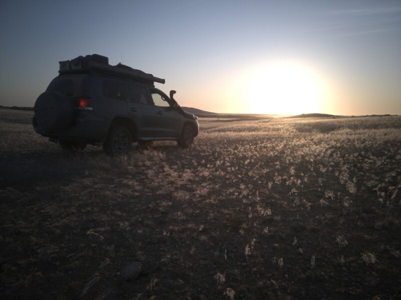 SUV at silhouette at sunset