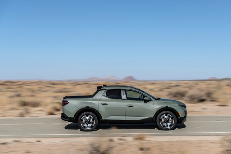 2022 Hyundai Santa Cruz driving on a highway in the desert