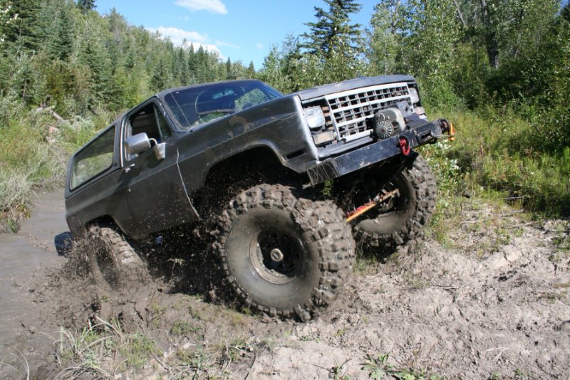 SUV Driving out of mud pit