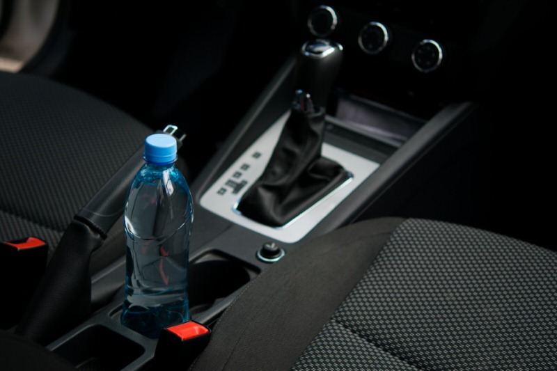 Water bottle in drink holder in center console of an SUV 
