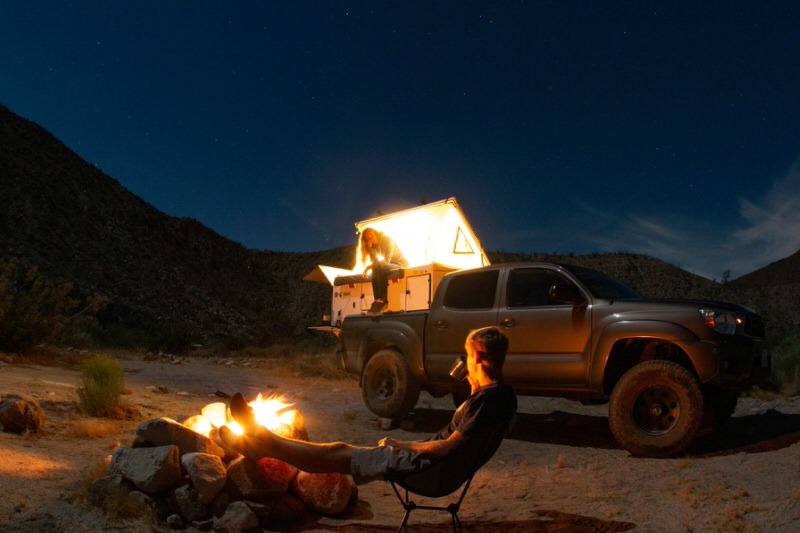 people camping with an SUV