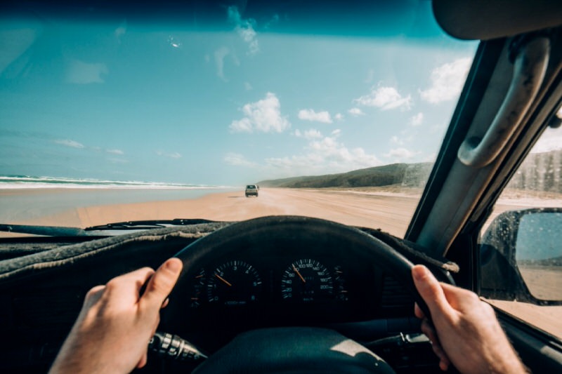 person driving on the beach