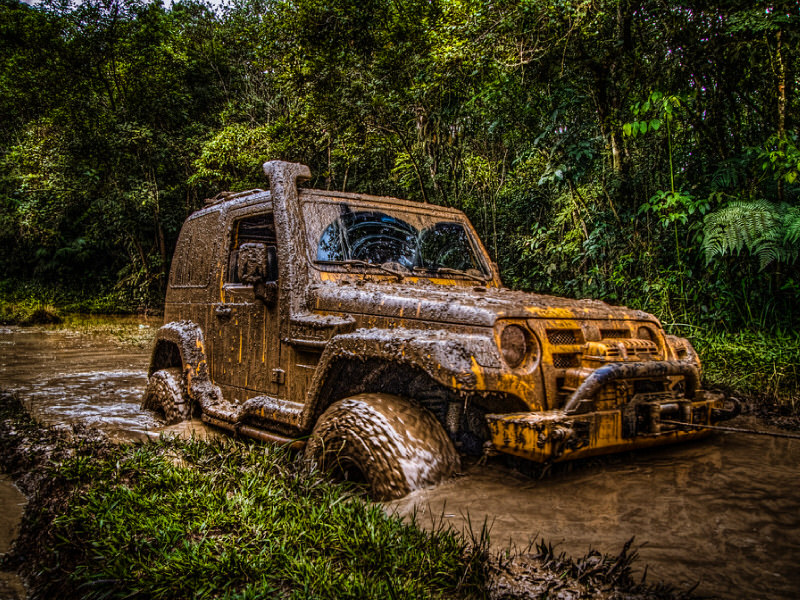 Jeep covered in mud
