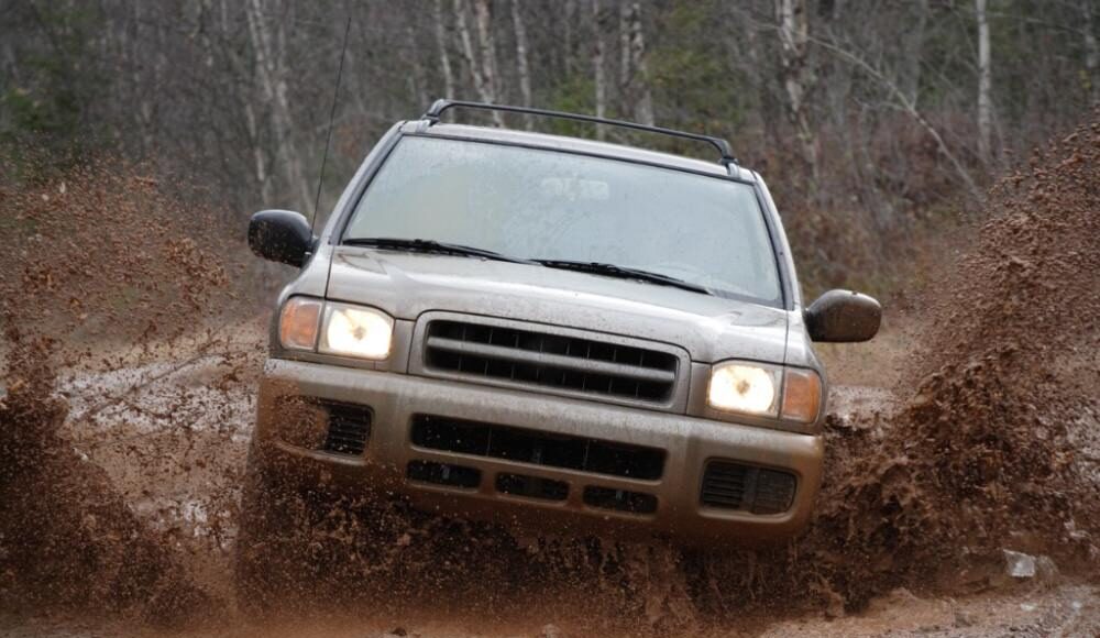SUV driving in the mud