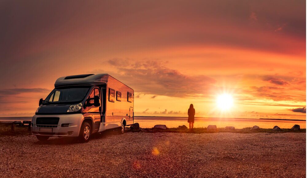 Person standing next to RV Boondocking