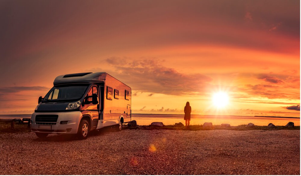 Person standing next to RV Boondocking