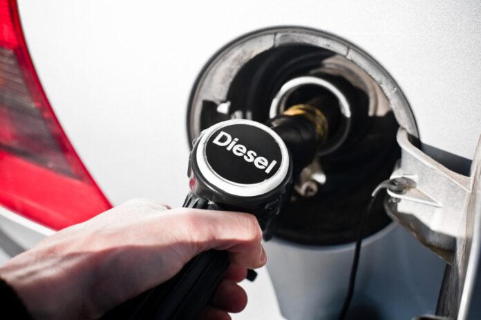 Person putting Diesel in a gas tank