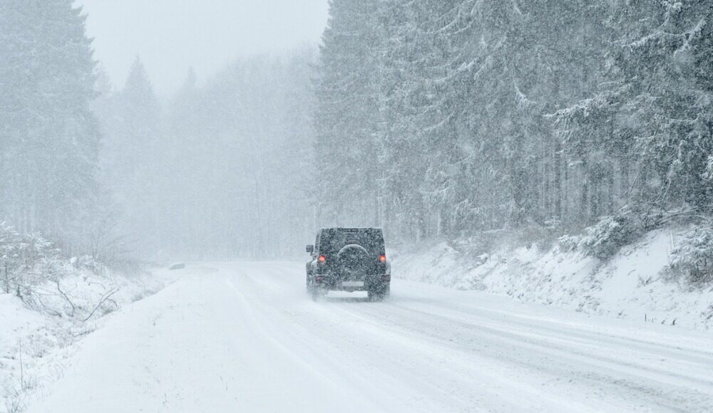 Jeep driving on a snowy road