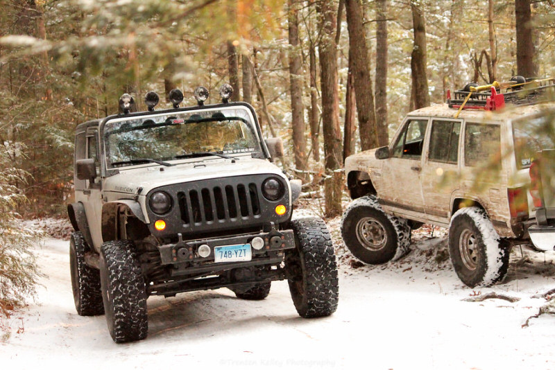 Two Jeeps in the forest in the snow