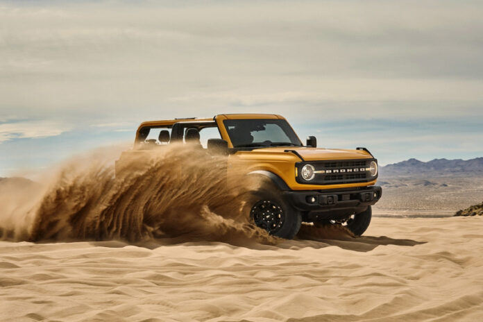 New Ford Bronco driving in sand