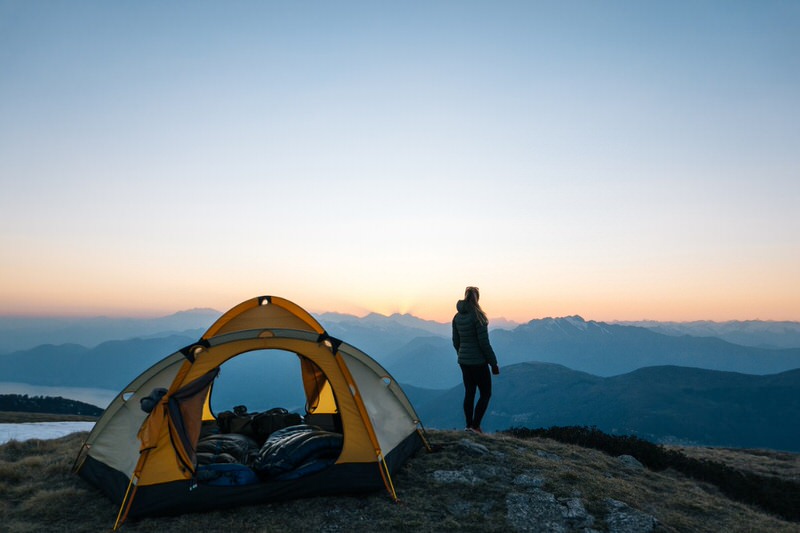 person enjoying the view while camping