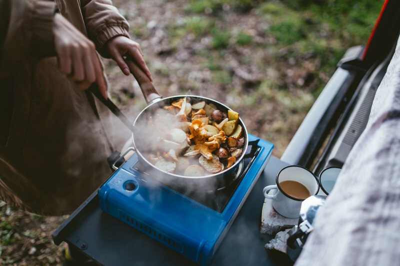 Cooking over a camp stove