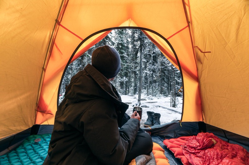 person in a warm tent 