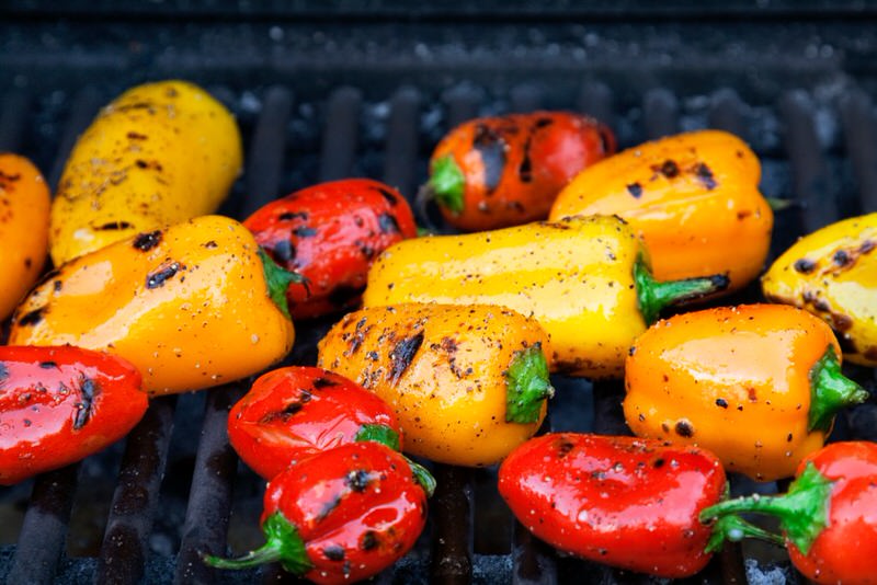 roasting peppers on a grill for an easy campfire recipe