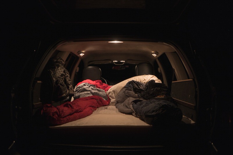 van camping with sleeping bags