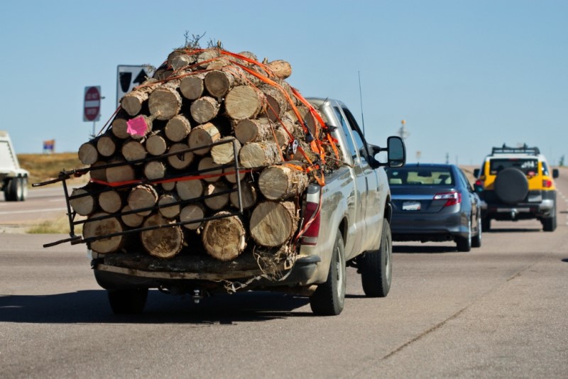 Truck overloaded with wood