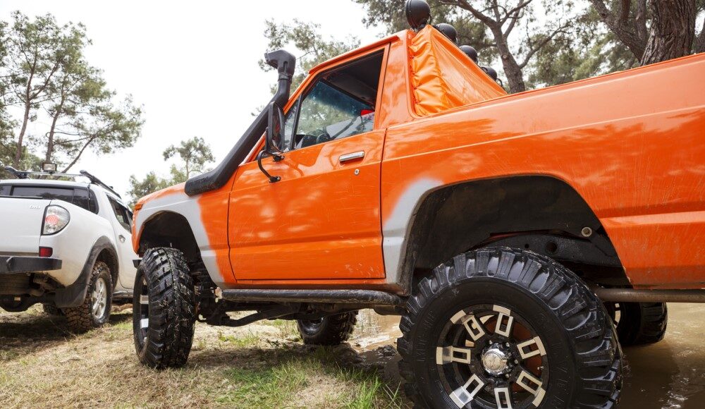 Orange truck with a body lift