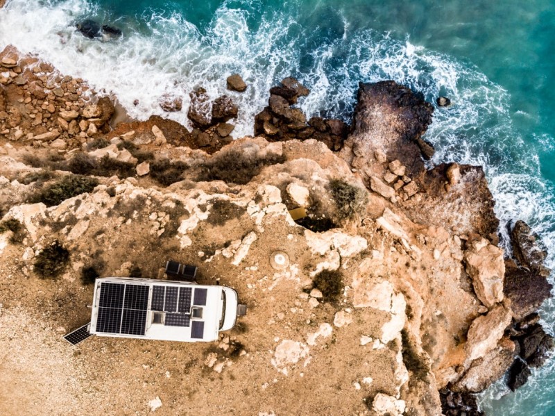 RV with Solar panels near the ocean