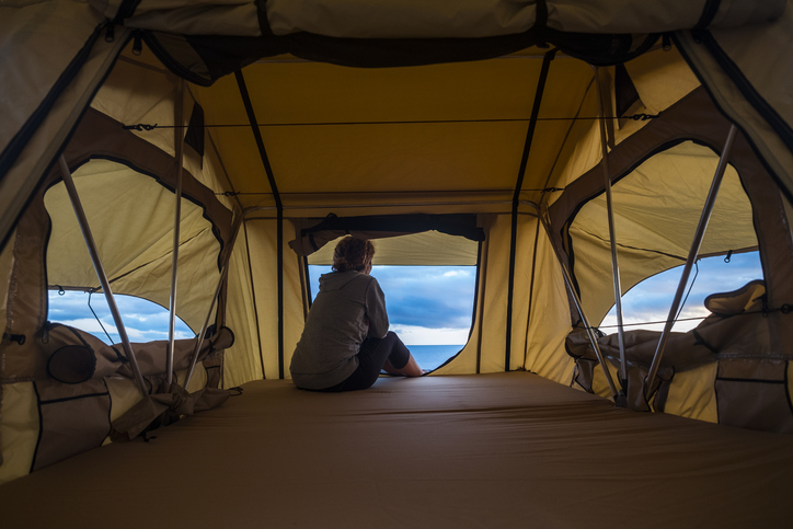 woman in a rooftop tent