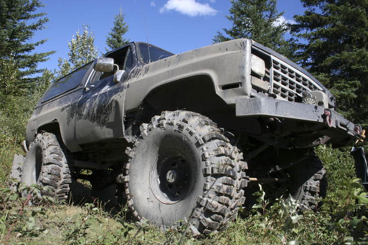 Muddy 4x4 truck with body lift