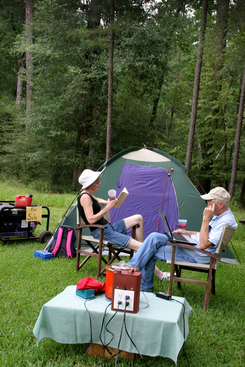 Couple camping, relaxing fuel cell power --gasoline generator