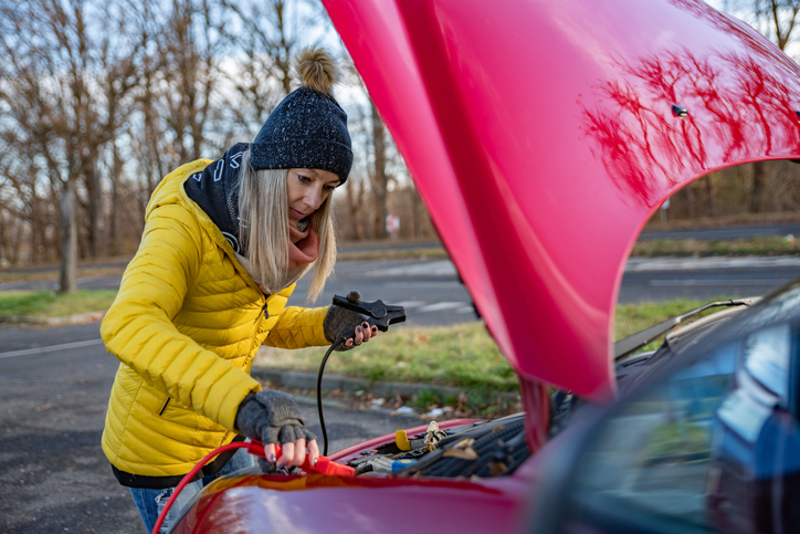Woman with jumper cables