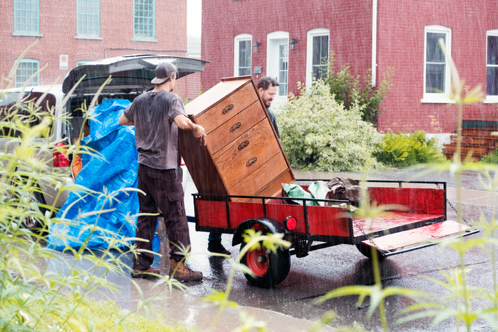 Two students move furniture in a raining day - How to Tie Down a Load
