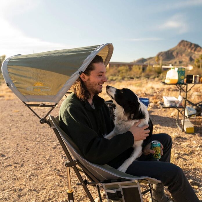 man and dog in a Camping Chair with Canopy