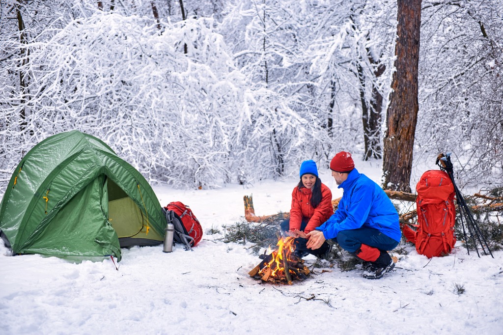two people camping in the winter