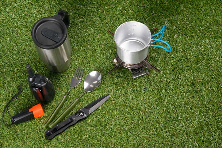 camping utensils on grass