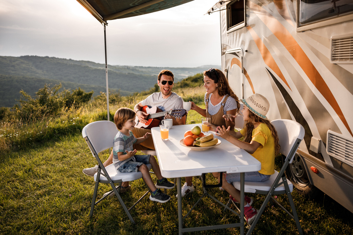 family at a camping table
