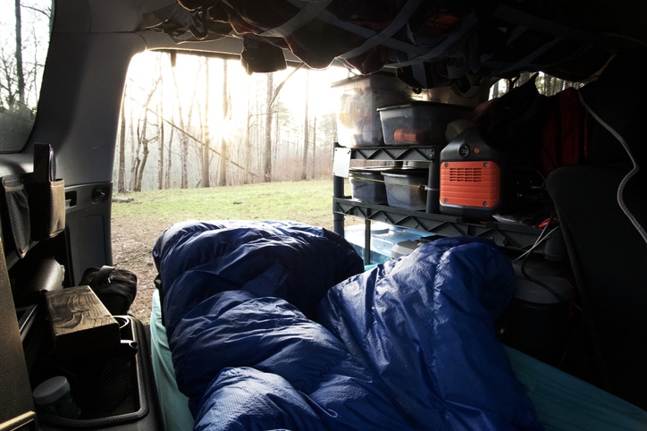 Overlanding bed in SUV at sunrise