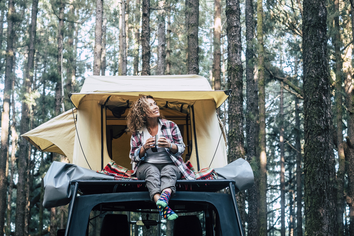 Woman in rooftop tent