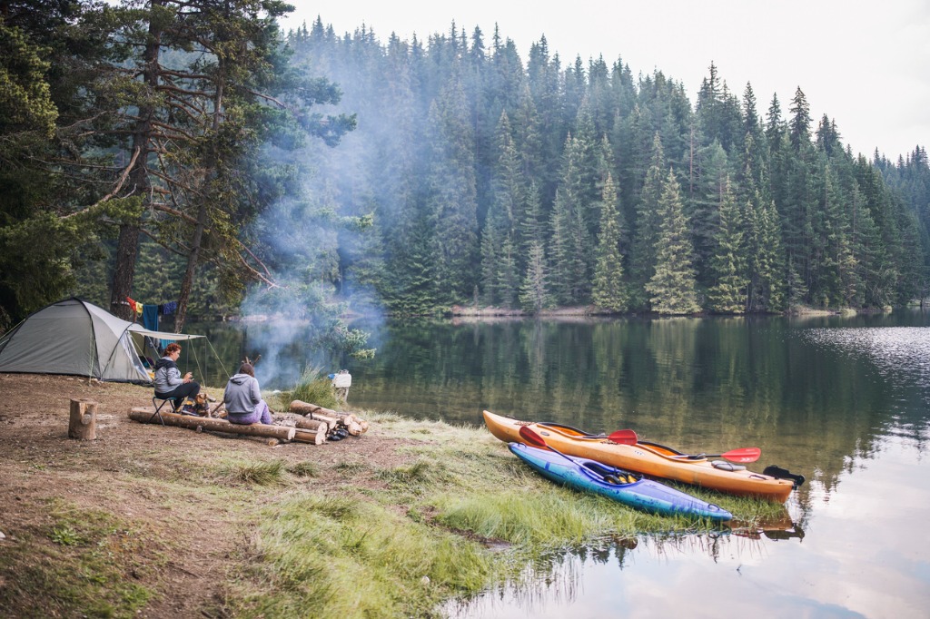 friends camping at a lake