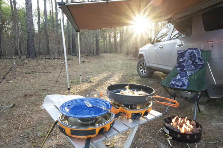 Cooking dinner in overlanding campsite