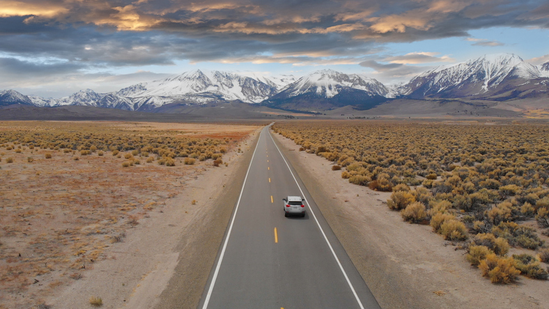 overlanding cars on a desert road