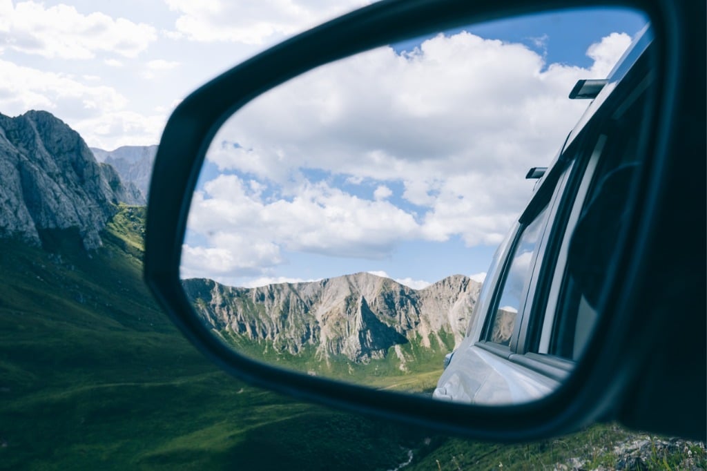 mountains in car side mirror