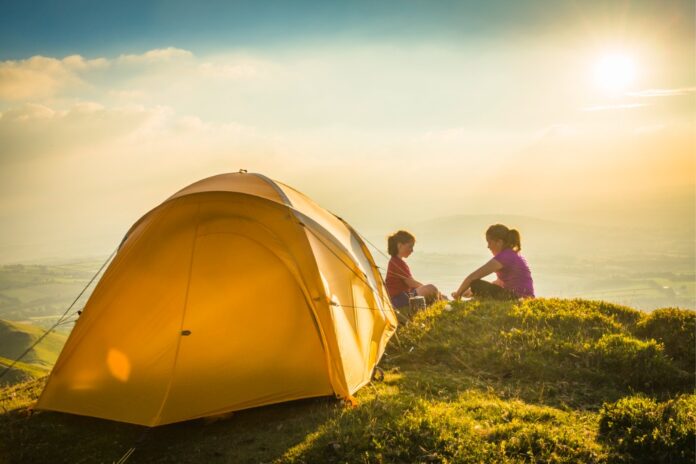 Two children near a tent