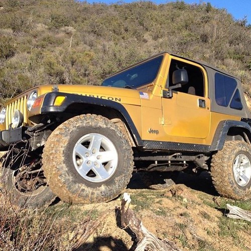 Yellow Jeep in the mountains