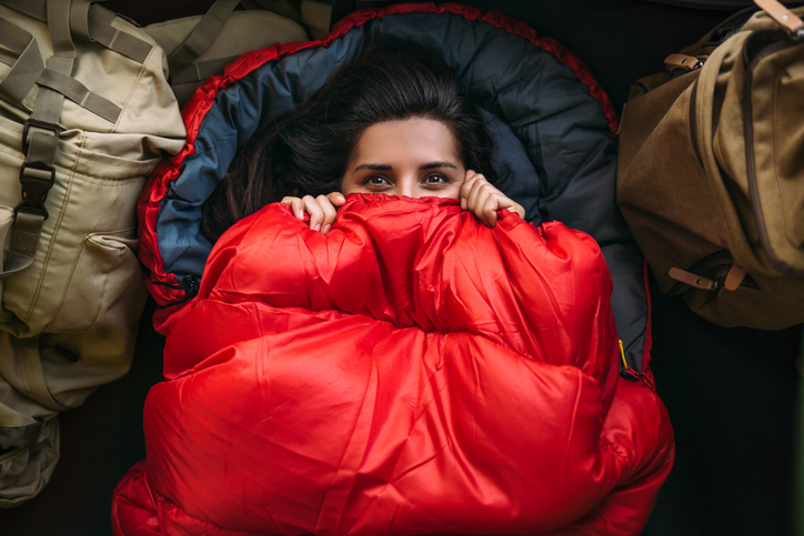 woman in a comfortable sleeping bag in a tent