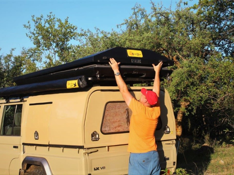 Eezi Awn Stealth Hard Cover Tent On Yellow Truck