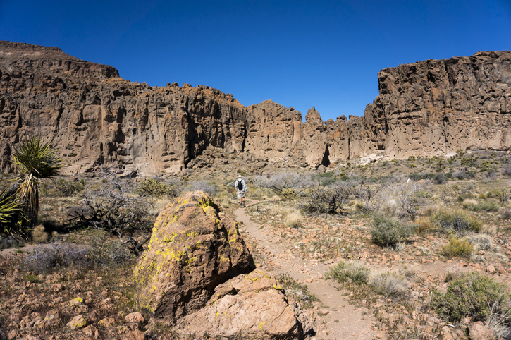 Southern California overlanding - A man hikes along the trail near Banshee Canyon in the Mojave National Preserve.